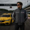man wearing gray embroidered jacket standing near yellow sports car