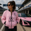 woman wearing pink embroidered jacket standing near pink sports car