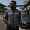 man wearing dark gray embroidered jacket near sports car
