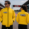 Aprilia Factory Racing yellow jacket front and back view worn by man and woman on racetrack with embroidered logo design